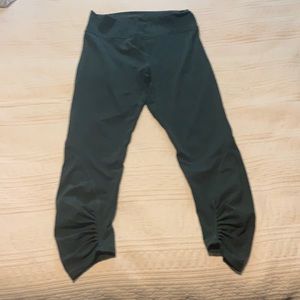 Size 12 tights. Greeny colour. Detail on leg.